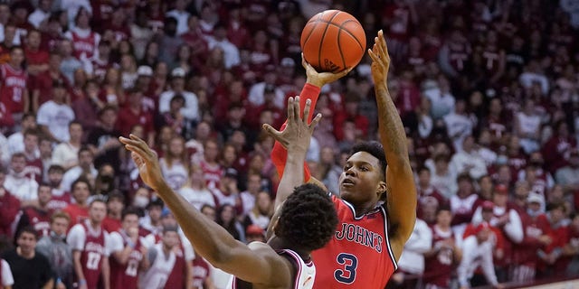 St. John's Stef Smith (3) shoots over Indiana's Xavier Johnson (0) during the first half of an NCAA college basketball game Wednesday, Nov. 17, 2021, in Bloomington, Indiana.