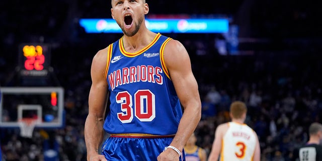 Golden State Warriors guard Stephen Curry reacts toward fans during the second half of a game against the Atlanta Hawks in San Francisco Nov. 8, 2021.