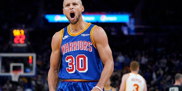 Golden State Warriors guard Stephen Curry reacts toward fans during the second half of a game against the Atlanta Hawks in San Francisco Nov. 8, 2021.