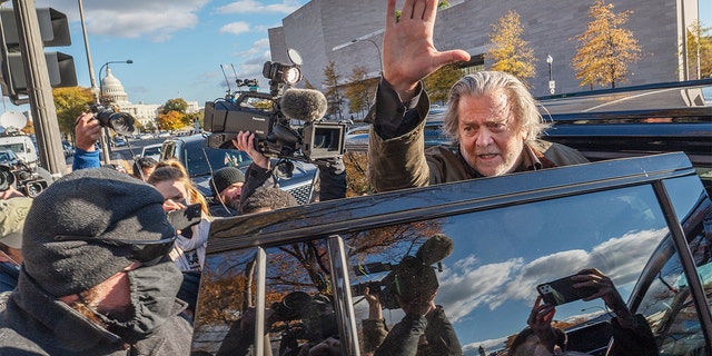 Steve Bannon, former adviser to Donald Trump, waves to members of the media as he departs federal court in Washington, D.C., on Monday, Nov. 15, 2021. Photographer: Craig Hudson/Bloomberg via Getty Images