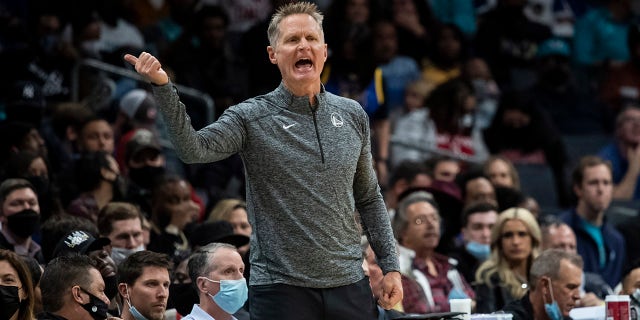 Golden State Warriors head coach Steve Kerr reacts during the first half of an NBA basketball game against the Charlotte Hornets, Sunday, Nov. 14, 2021, in Charlotte, North Carolina.