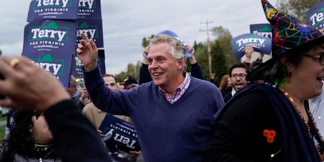 Virginia Democratic gubernatorial nominee and former Gov. Terry McAuliffe waves during 65th annual Leesburg Halloween Parade in downtown Leesburg, Virginia, U.S., October 31, 2021. REUTERS/Joshua Roberts