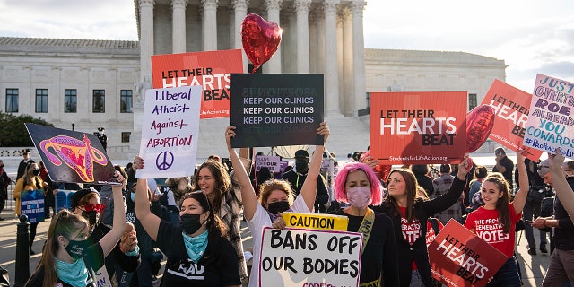 Pro-choice and anti-abortion demonstrators rally outside the U.S. Supreme Court on Nov. 1, 2021 in Washington.