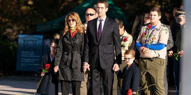 Sen. Tom Cotton (R-AR), and his family, stand before placing flowers during a centennial commemoration event at the Tomb of the Unknown Soldier in Arlington National Cemetery on November 9, 2021, in Arlington, Virginia. (Photo by Alex Brandon-Pool/Getty Images)