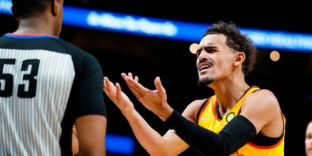 Atlanta Hawks guard Trae Young reacts after a call during the first half of the team's NBA basketball game against the Utah Jazz on Thursday, Nov. 4, 2021, in Atlanta.