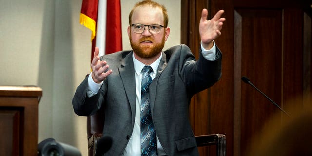 Travis McMichael speaks from the witness stand during his trial Wednesday, Nov. 17, 2021, in Brunswick, Ga. (AP Photo/Stephen B. Morton, Pool)