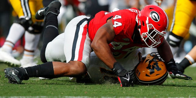 Travon Walker #44 of the Georgia Bulldogs sacks Tyler Macon #10 of the Missouri Tigers in the second half at Sanford Stadium on November 6, 2021 in Athens, Georgia.