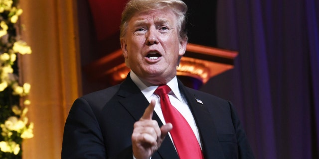 Former President Donald Trump arrives to speak at the National Republican Congressional Committee's annual spring dinner in Washington, April 2, 2019.