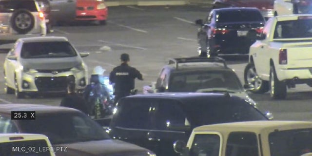 Surveillance video shows Tucson police officer Ryan Remington following a man he shot and killed Monday night.