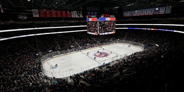The puck is dropped at the new UBS Arena as the Calgary Flames take on the New York Islanders in the first period Saturday, Nov. 20, 2021, in Elmont, N.Y.