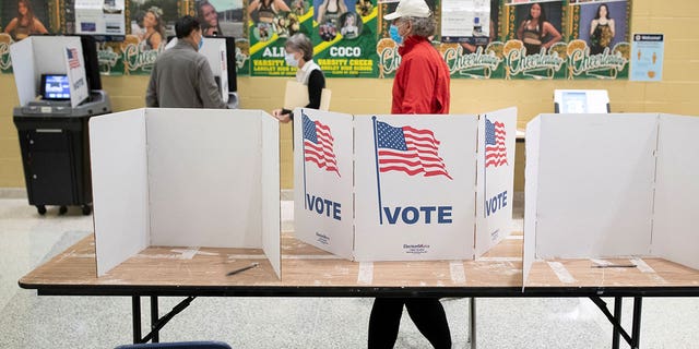 Voters cast their ballots during the Virginia governor race at Langley High School in McLean, Virginia, on Nov. 2, 2021.