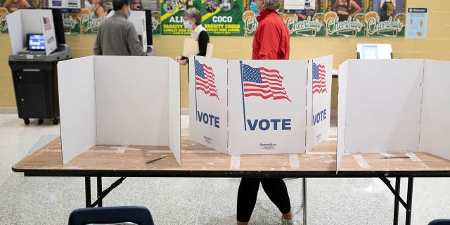 Voters cast their ballots during the Virginia Governor Race, at Langley High School in McLean, Virginia, U.S., November 2, 2021.