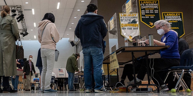 Voters wait for their ballot papers at George Marshall High School on Election Day in Falls Church, Virginia on November 2, 2021.  Skirmish of error is considered the first major test of President Joe Biden's political brand.  (Photo by ANDREW CABALLERO-REYNOLDS / AFP) (Photo by ANDREW CABALLERO-REYNOLDS / AFP via Getty Images)