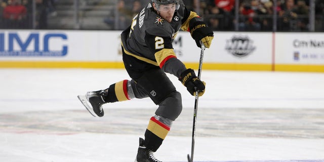 Zach Whitecloud shoots the puck