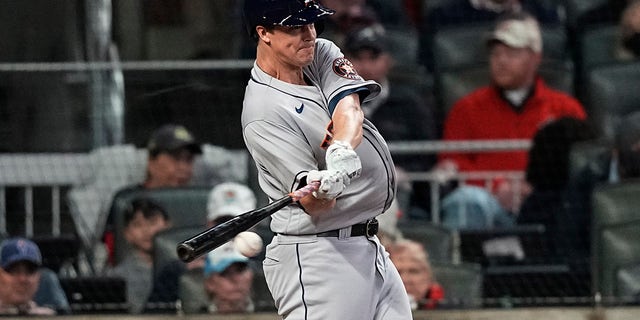 Houston Astros' Zack Greinke hits a single during the second inning in Game 4 of baseball's World Series between the Houston Astros and the Atlanta Braves Saturday, Oct. 30, 2021, in Atlanta.