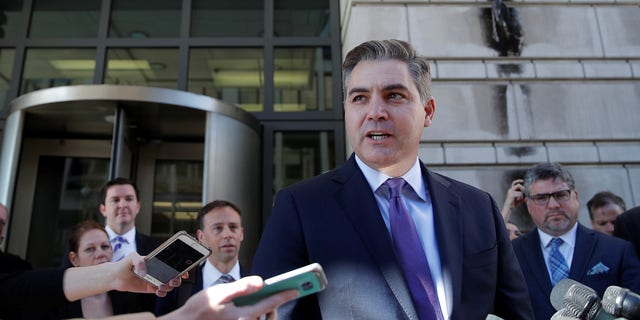 CNN chief White House correspondent Jim Acosta talks to reporters after a judge temporarily restored his White House press credentials on Nov. 16, 2018.