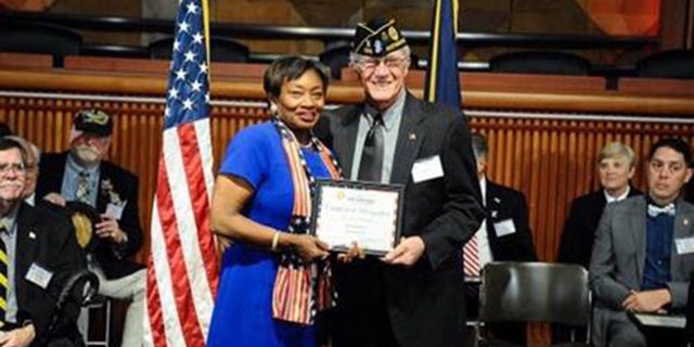 Veteran Richard Pecci with N.Y. State Senate Majority Leader Andrea Stewart-Cousins, in 2018, during his induction into the New York State Senate Veterans Hall of Fame in Albany, N.Y.