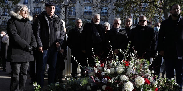 Members of the Muslim community pay their homage to the victims of the Nov. 2015 attacks outside the Bataclan concert hall in Paris on Friday, the eve of the sixth anniversary of the attacks. 