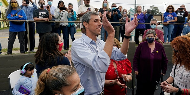 Democrat Beto O'Rourke, center, claps for supporters during a campaign stop, Tuesday, Nov. 16, 2021, in San Antonio. O'Rourke announced Monday that he will run for Texas governor. (AP Photo/Eric Gay)