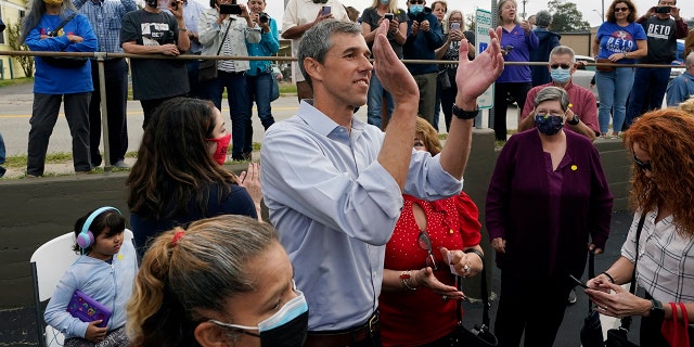 Democrat Beto O'Rourke, center, claps for supporters during a campaign stop, Tuesday, Nov. 16, 2021, in San Antonio. O'Rourke announced Monday that he will run for Texas governor. (AP Photo/Eric Gay)