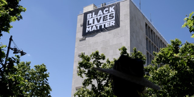 A banner in support of the Black Lives Matter movement on the building of the U.S. Embassy in Spain, on May 25, 2021, in Madrid, Spain.