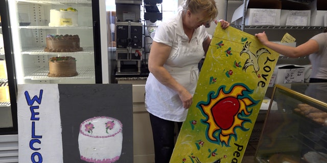 Oliver's Bakery owner, Annie Benson, says she'll keep her boards up by the summer of 2020, but hopes she won't have to use them again