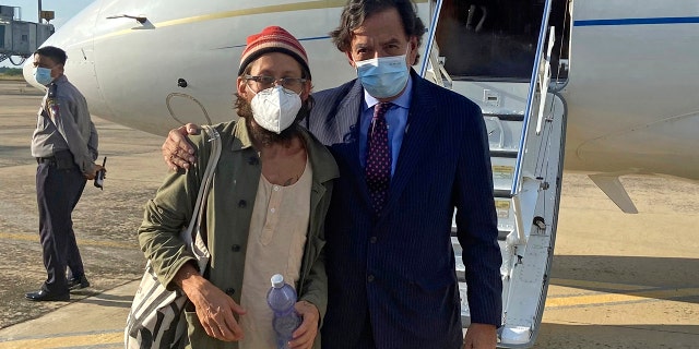 Former U.S. Ambassador to the U.N. Bill Richardson poses with journalist Danny Fenster in Naypyitaw, Burma, Monday, Nov. 15, 2021.