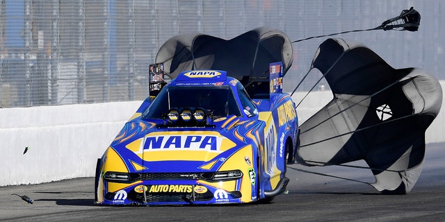 A radio bounced down the track after falling off of Ron Capps Funny Car during the first round of eliminations.