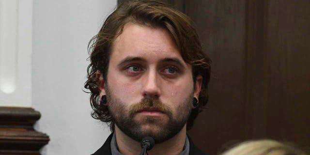 A tear rolls down the cheek of Gaige Grosskreutz as he testifies about being shot in the right bicep, during the Kyle Rittenhouse trial in Kenosha Circuit Court, Monday, Nov. 8, 2021, in Kenosha, Wis. Rittenhouse, an aspiring police officer, shot two people to death and wounded a third during a night of anti-racism protests in Kenosha in 2020.