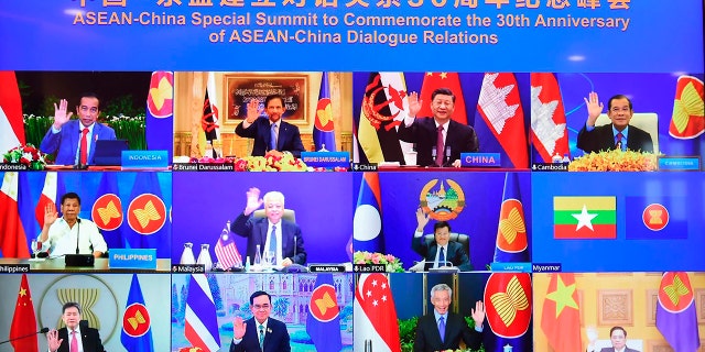 This image provided by Malaysia Prime Minister Office shows ASEAN leaders and Chinese President Xi Jinping, top, second from right, on screen during an online meeting of the ASEAN-China special summit in Kuala Lumpur, Malaysia, Monday, Nov. 22, 2021. 