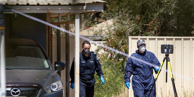 Police investigate at a house, Thursday, Nov. 4, 2021, where 4-year-old Cleo Smith was rescued in Carnarvon, Australia. 