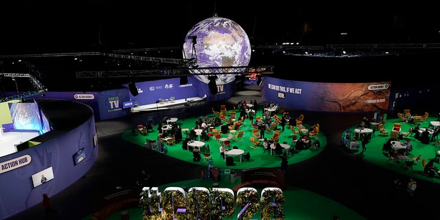 People gather in the Action Zone inside the venue for the COP26 U.N. Climate Summit in Glasgow, Scotland on Monday.