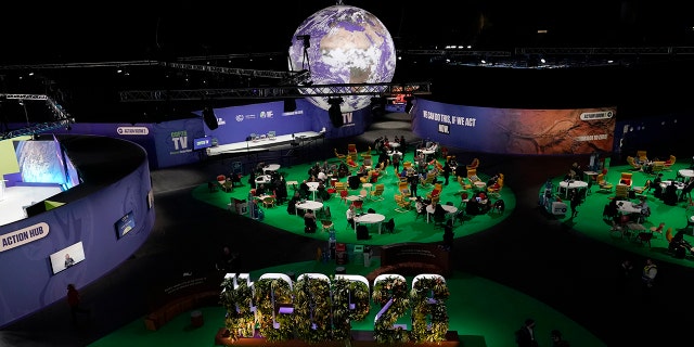 People gather in the Action Zone inside the venue for the COP26 U.N. Climate Summit in Glasgow, Scotland on Monday.