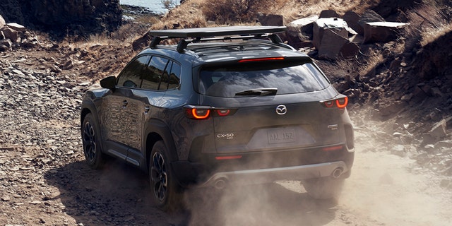 The Mazda CX-50 features body cladding and a raised ride height.