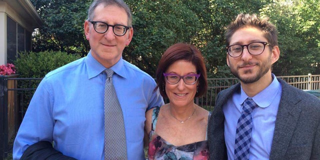 Buddy, from left, and Rose Fenster, and their son Danny Fenster pose for a photo in Huntington Woods, Michigan, in 2014.