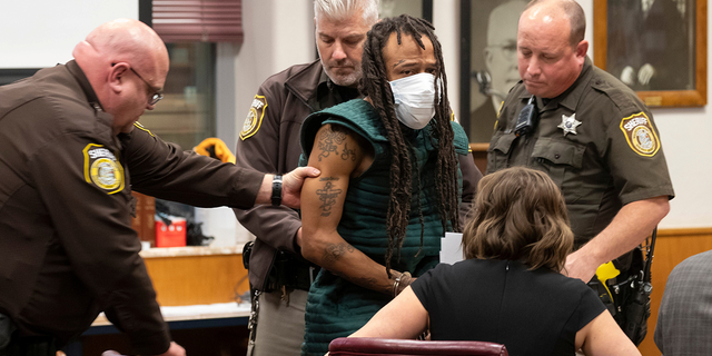 Darrell Brooks, charged with killing five people and injuring nearly 50 after plowing through a Christmas parade with his sport utility vehicle on November 21, appears in Waukesha County Court in Waukesha, Wisconsin, U.S. November 23, 2021.