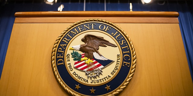 The U.S. Department of Justice seal on a podium in Washington, D.C. 