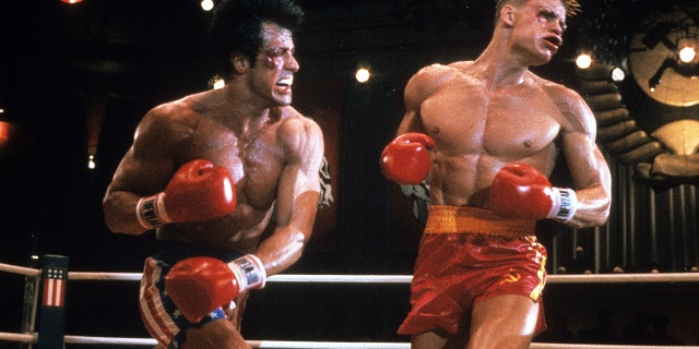 Sylvester Stallone punches Dolph Lundgren in a scene from the film 'Rocky IV', 1985.