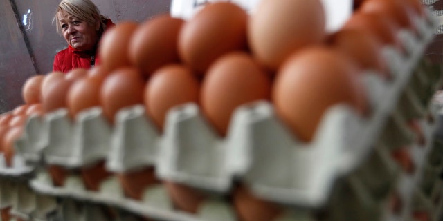Vendor Judit Sos sells eggs in a food market in Budapest, Hungary, on Nov. 20, 2021.