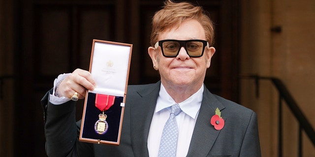 Sir Elton John after being made a member of the Order of the Companions of Honour for services to music and to charity during an investiture ceremony at Windsor Castle, in Windsor, England on Wednesday, Nov. 10, 2021.