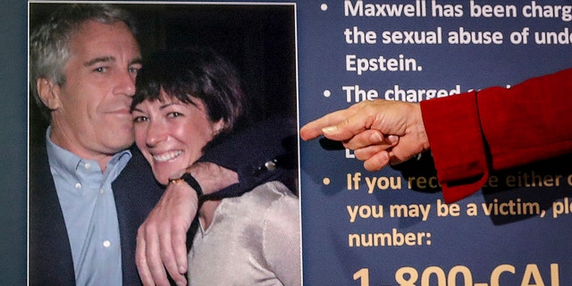 Audrey Strauss, acting U.S. attorney for the Southern District of New York, points to a photo of Jeffrey Epstein and Ghislaine Maxwell during a news conference in New York, July 2, 2020. 