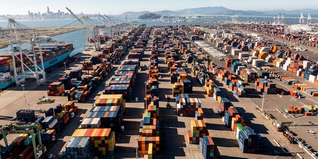 Containers line a Port of Oakland shipping terminal on Wednesday, Nov. 10, 2021, in Oakland, Calif. Intense demand for products has led to a backlog of container ships outside the nation's two largest ports along the Southern California coast.