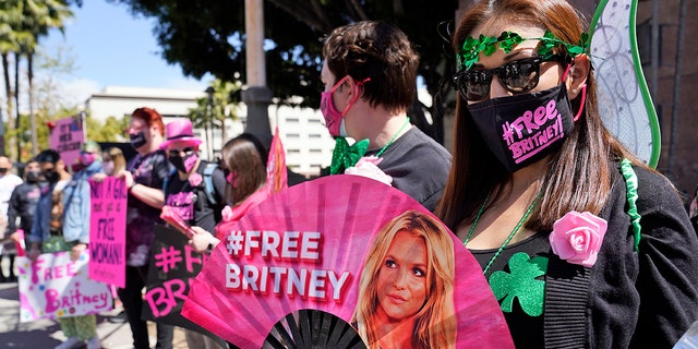 Britney Spears supporter Kiki Norberto holds a hand fan outside a court hearing concerning the pop singer's conservatorship at the Stanley Mosk Courthouse in March in Los Angeles. 