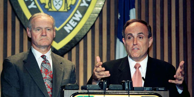 Then-New York City Mayor Rudy Giuliani, right, speaks as New York City Police Commissioner Howard Safir looks on during a news conference in an undated photo. Safir served as commissioner from 1996 to 2000.