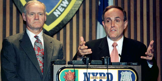 Then-New York City Mayor Rudy Giuliani, right, speaks as New York City Police Commissioner Howard Safir looks on during a news conference in an undated photo. Safir served as commissioner from 1996 to 2000.