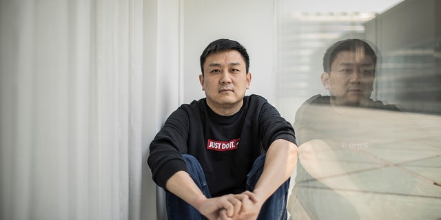 U.S. citizen Daniel Hsu poses for a portrait in an apartment in Shanghai, China, on April 13, 2020.  