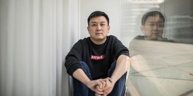 U.S. citizen Daniel Hsu poses for a portrait in an apartment in Shanghai, China, on April 13, 2020.
