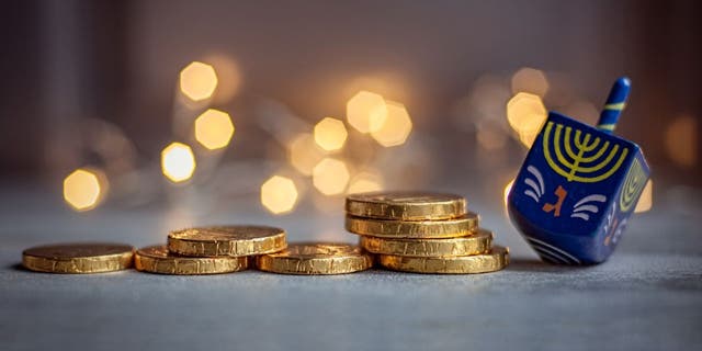 Dreidels and chocolate coins are often given to children during Hanukkah celebrations.