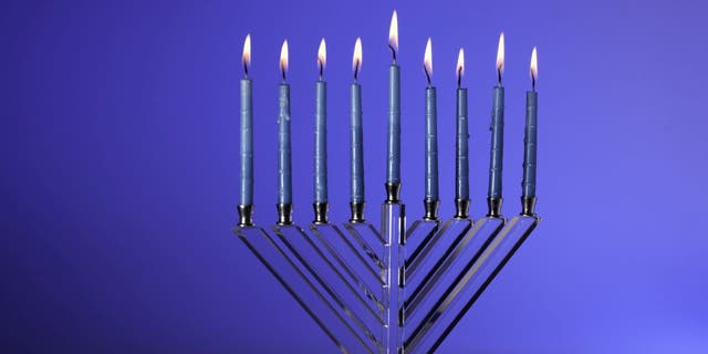Hanukkah's Menorah has eight candle arms that represent the eight nights when the oil lamps of the Second Temple burned. The central candle arm, technically ninth, is reserved for helper candles. 
