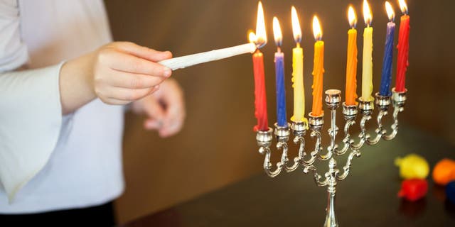 Jewish people around the world observe the holiday with a special Hanukkah menorah, which has nine candle arms.